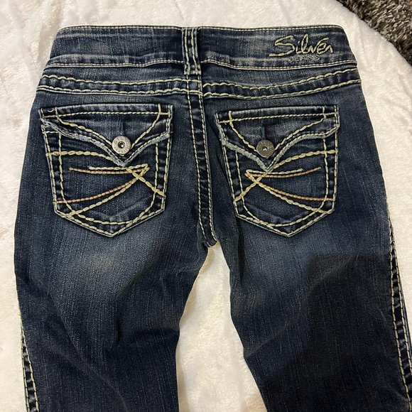 Silver denim slim bootcut jeans.  Embroidered, buttoned back pockets.  Size 24 - Picture 3 of 11
